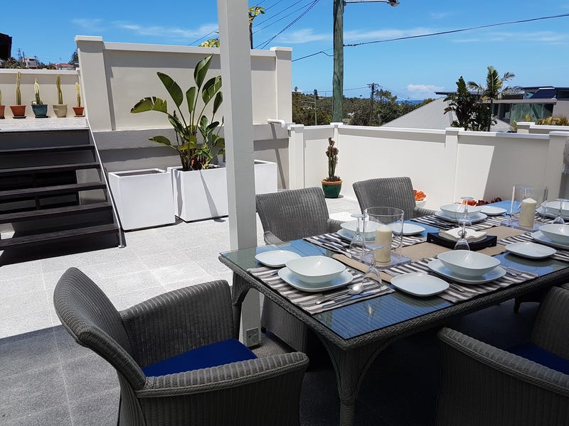 Curly Beachside Patio Apartment 12