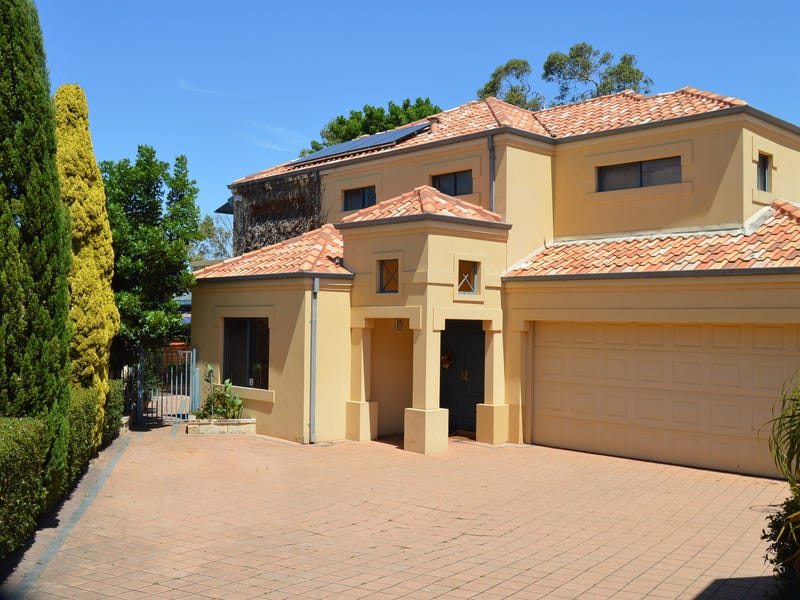 Tuscan style family home with 4 bedrooms and 3 bathrooms.