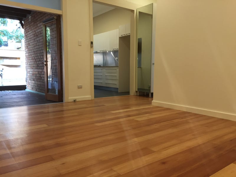 Spacious living with own hardwood deck, renovated high-end finishes – rare ground floor unit!