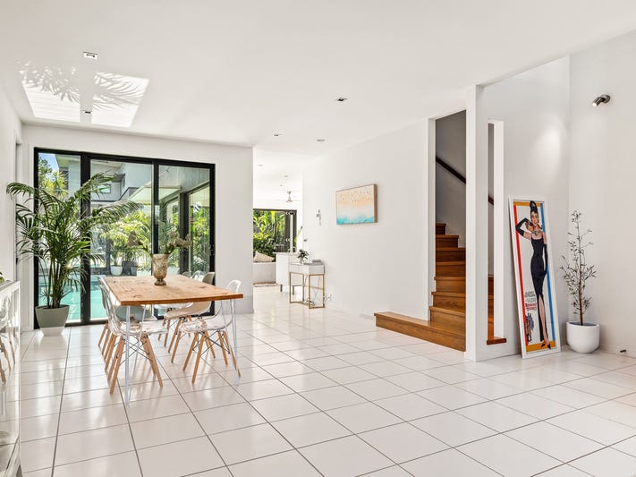 Light-filled modern home surrounded by 4
