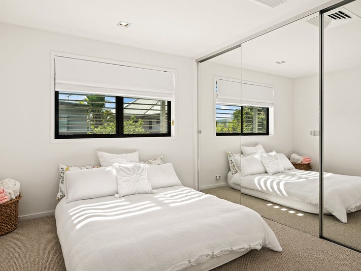 Light-filled modern home surrounded by 9