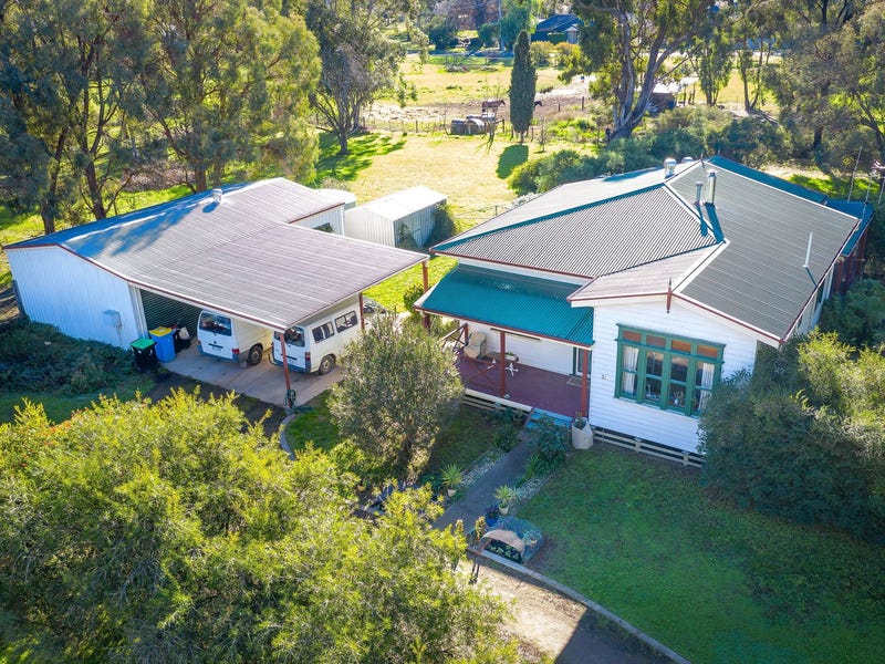 Residential home w/ large Garage and Shed. Plenty of land