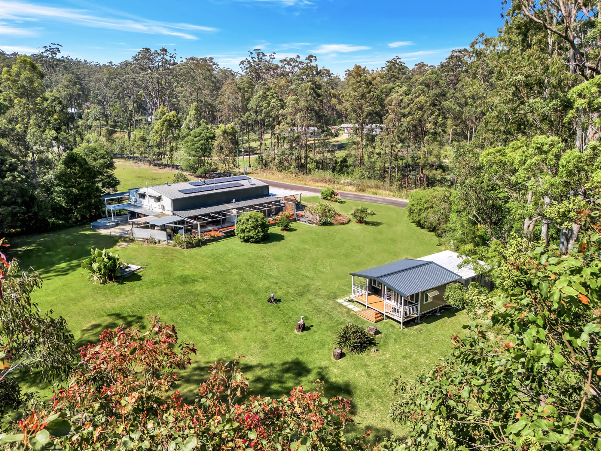 Versatile Shed Style Home on 1.62 Acres with Tiny House, Dual Living Potential, and Room for All Your Hobbies